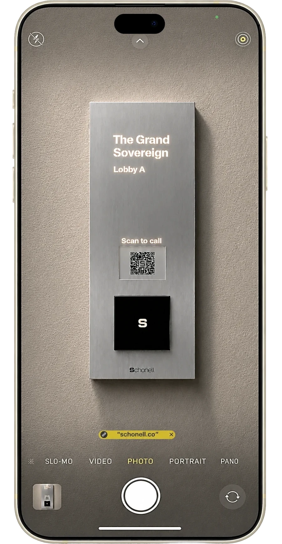 Scanning the Schonell lobby panel QR code with a phone camera
