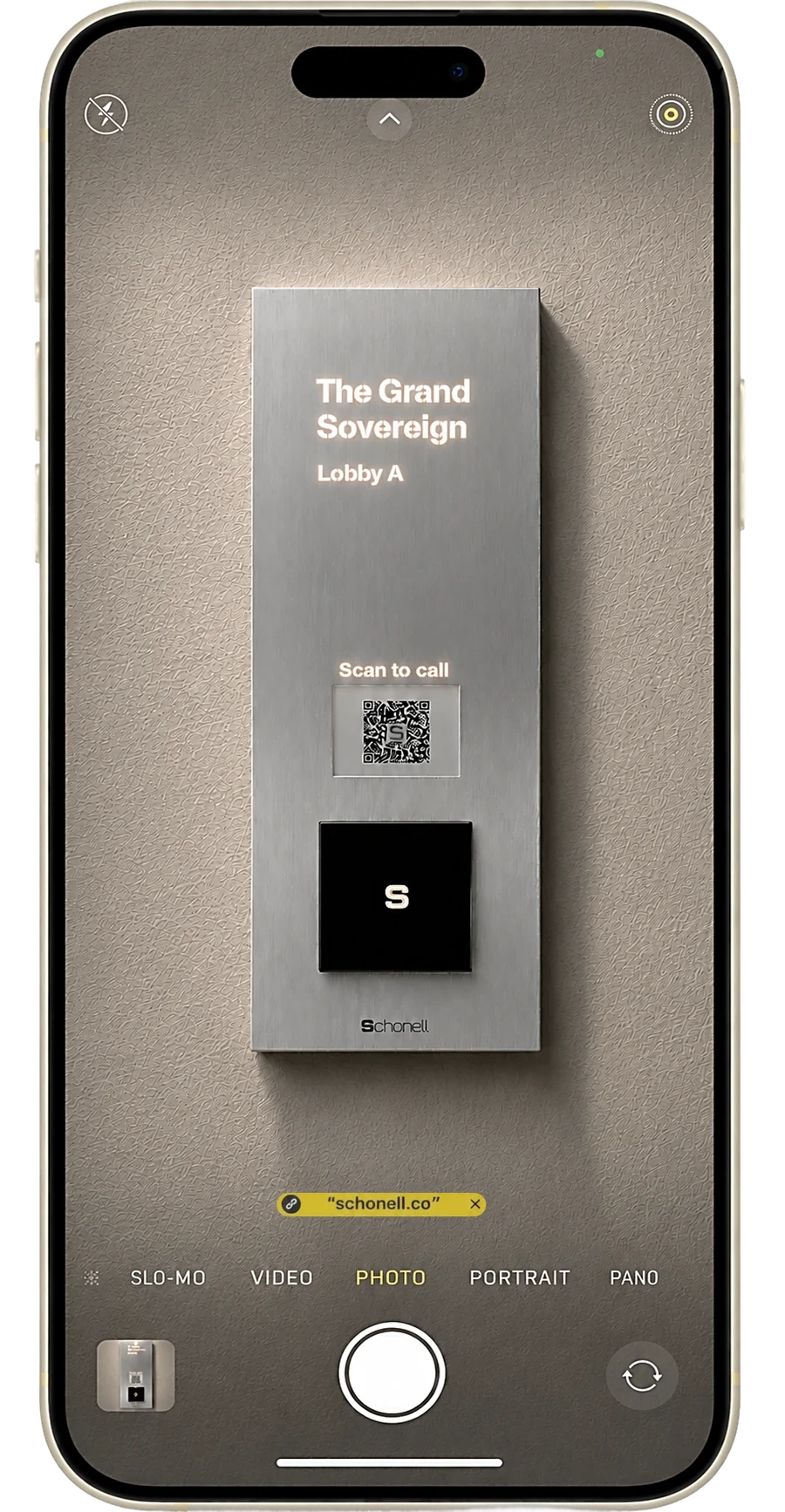 Scanning the Schonell lobby panel QR code with a phone camera